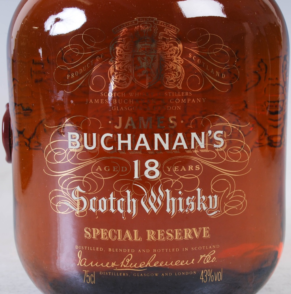 Three bottles of Scotch Whisky, comprising, boxed James Buchanan's