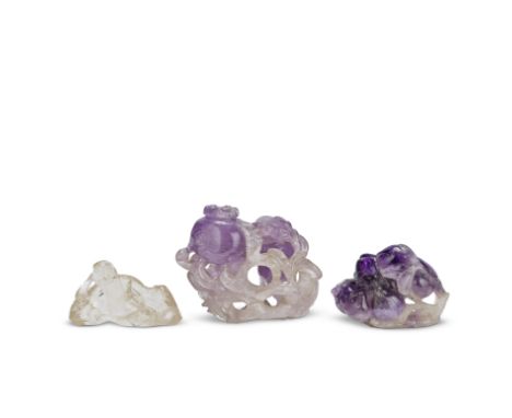 TWO CARVED AMETHYST 'FRUIT' CARVINGS AND A ROCK CRYSTAL 'LI BAI' CARVING19th centuryThe first modelled as the Three Abundance
