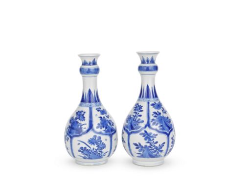 A PAIR OF BLUE AND WHITE PEAR-SHAPED VASESKangxiEach brightly painted on the body with two rows of petal-shaped panels filled