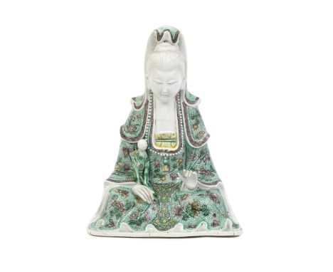 A FAMILLE VERTE BISCUIT SEATED 'GUANYIN AND CHILD' GROUPKangxiThe elegant, serene figure wearing a high cowl and flowing robe