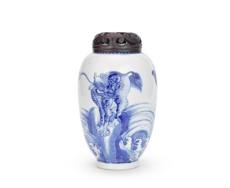 A BLUE AND WHITE OVOID JARKangxiDecorated with birds of prey and two qilin standing on rockwork amongst turbulent waves, pier
