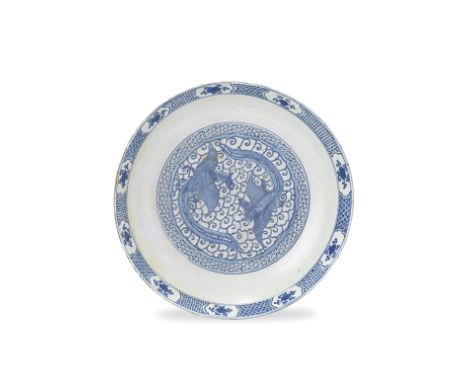 A LARGE BLUE AND WHITE 'PHOENIX' DISHLate Ming DynastyPainted to the well with two confronting phoenix amongst ruyi form clou