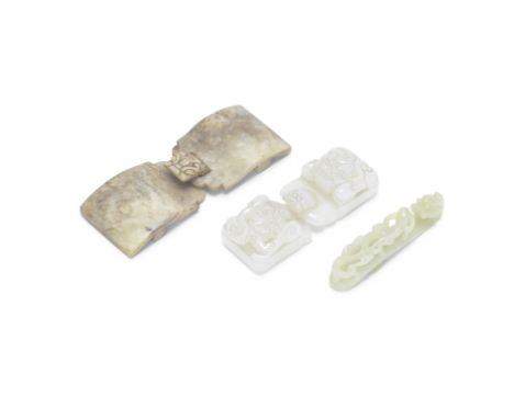 TWO JADE BELT BUCKLES AND A BELT HOOKQing DynastyComprising: a pale green and russet jade archaistic belt buckle with a drago