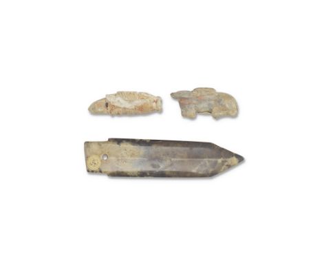 THREE ARCHAIC JADE CARVINGSShang to Han DynastyComprising: a miniature jade blade, ge, each side with a pronounced median rid