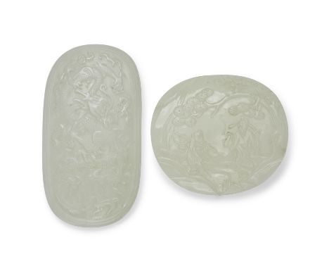 TWO PALE CELADON JADE OVAL PLAQUESQing DynastyOne finely incised to depict a dragon writhing among flames and clouds within a