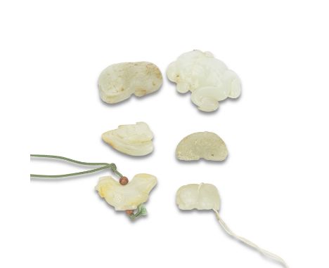 A GROUP OF SIX VARIOUS JADE ANIMAL CARVINGSQing DynastyComprising: a white jade toad; a pale celadon and russet bird pendant;