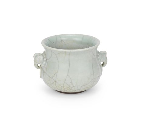 A GUAN-TYPE INCENSE BURNER19th centuryOf compressed globular form with waisted neck and flared mouth, the body flanked by mou