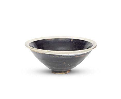 A BLACK-GLAZED WHITE-RIMMED BOWLSong DynastyThe conical bowl covered to the interior and exterior with a glossy black glaze s