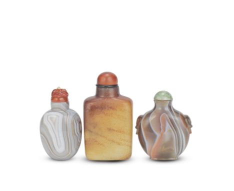 A JADE SNUFF BOTTLE AND TWO AGATE SNUFF BOTTLES19th century Comprising: a jade bottle of rounded rectangular form, the stone 
