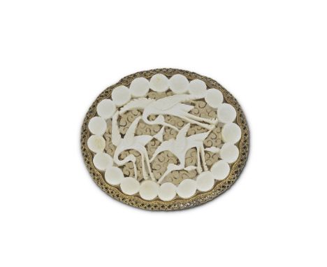 A WHITE JADE 'CRANES' PLAQUEMing DynastyPierced and carved with three cranes against a dense ground of cloud scrolls, within 