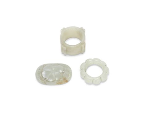 A RETICULATED JADE FLORAL PLAQUE, A LOBED JADE RING AND A JADE CYLINDERSong-Ming DynastyThe plaque of convex oval form reticu