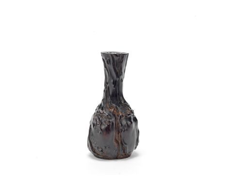 A CARVED ZITAN WOOD TOOL VASE18th/19th centuryThe bottle-form vase naturalistically carved to resemble a gnarled tree trunk, 