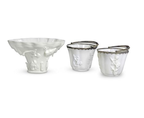 A PAIR OF MOULDED LOBED BLANC-DE-CHINE CUPS WITH EUROPEAN SILVER-GILT MOUNTS; AND A MOULDED LIBATION CUPKangxiThe two cups, e