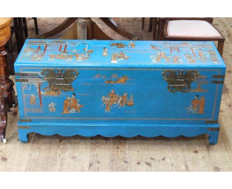 Blue lacquered and chinoiserie painted trunk, the interior decorated with Chinese characters and figures, 53cm high by 116cm 
