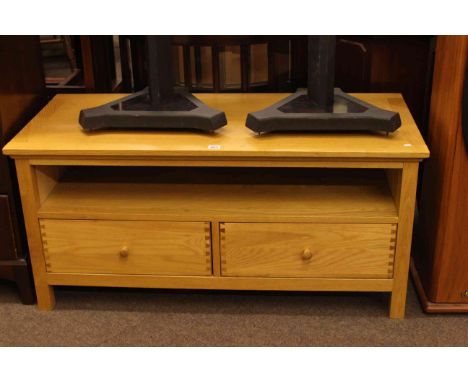 Light oak two drawer entertainment unit, 52cm high by 110cm wide by 49cm deep.