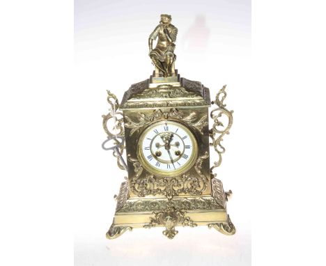 Highly decorative brass mantel clock with a knight as the top centre piece, 40cm high.
