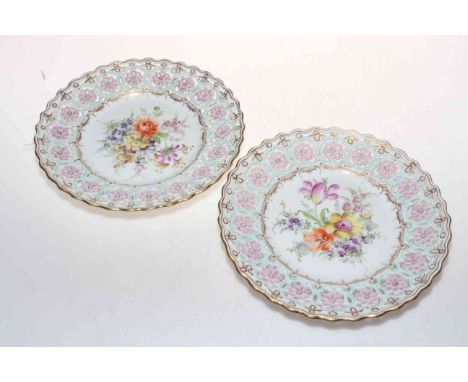 Pair Dresden flower decorated and pierced border plates, 22cm diameter.