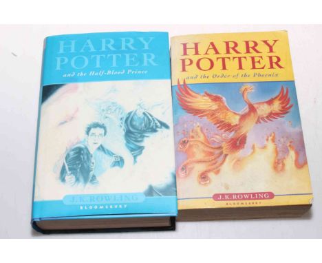 Two Harry Potter books, First Edition Half Blood Prince with dust cover and another.