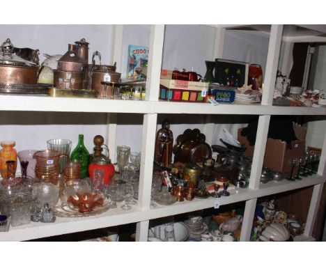 Full shelf of assorted glass, metalwares, kitchen scales and weights, mantel clock, linen, books etc.