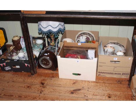 Four boxes of assorted china, glass, oak mantel clock, figure table lamp, cutlery, etc.