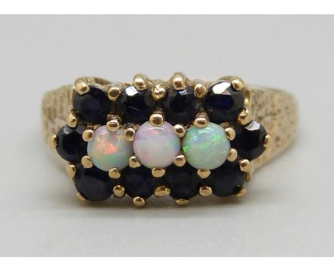 A 9ct gold, opal and sapphire ring, 3.6g, S 