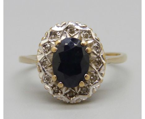 A 9ct gold ring set with a sapphire and diamonds, 2.8g, P 