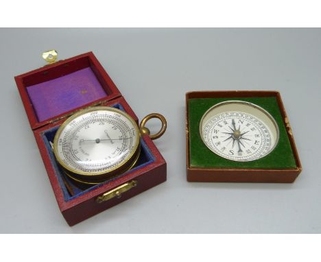 A 19th Century pocket barometer, cased, and a later compass 