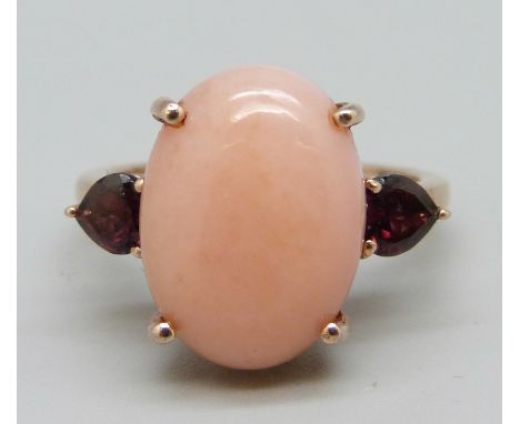 A silver gilt, coral coloured cabochon and red stone ring, V 