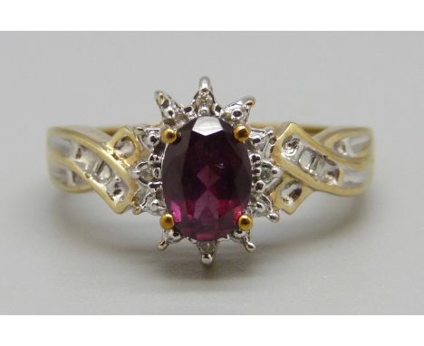 A 9ct gold cluster ring set with diamonds and a ruby, 3.2g, N 