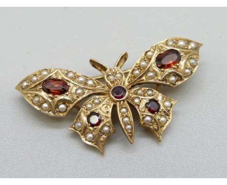 A 9ct gold, garnet and seed pearl butterfly brooch, 5g, 35mm 