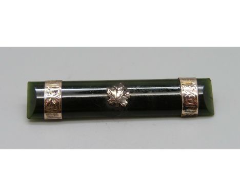 A vintage 9ct gold mounted jade brooch, 55mm 
