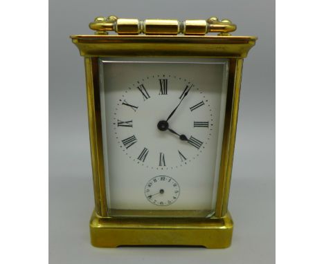 A four glass sided brass carriage clock with alarm and key 