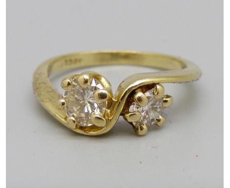 An 18ct gold crossover diamond ring, approximately 0.70ct diamond weight, 3g, K 