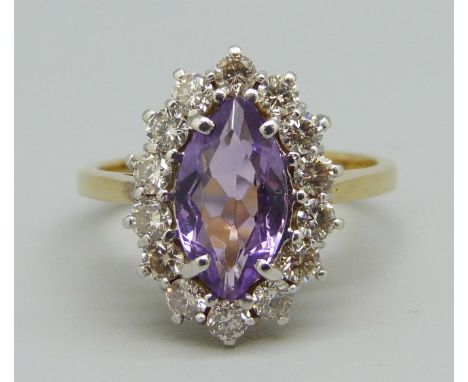 An 18ct gold, diamond and amethyst fifteen stone cluster ring, London 2003, over 0.5ct diamond weight, 4.3g, N 