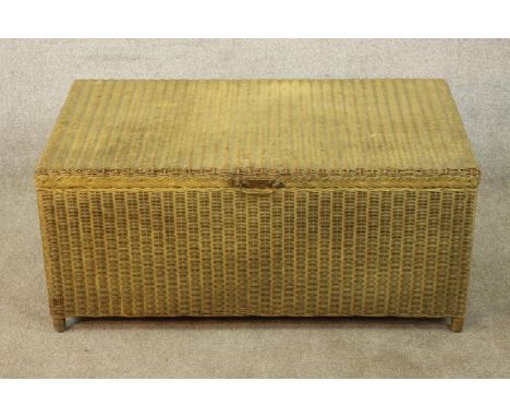 A 1930s painted Lloyd loom style ottoman/ blanket trunk raised on short supports, H.41 W.91 D.53cm. 