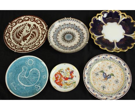 A collection of six ceramic plates, including a lustre ware platter with bird and foliate design, a Rosenthal Golden Orient M