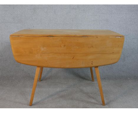 A 20th century Ercol elm top drop flap table, model 383, raised on four splayed tapering supports, H.70 W.123 D.111cm (extend