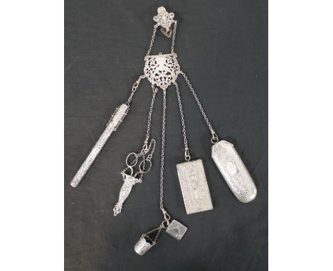 A Victorian and later silver and silver plate chatelaine with six attachments, including a silver plate dance card holder, a 