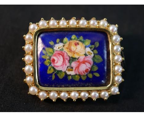 An Italian 18 carat yellow gold and enamel brooch, set with a border of twenty eight round cultured pearls, the royal blue en