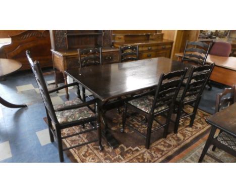 A Rectangular Oak Refectory Dining Table and Six Ladder Back Chairs