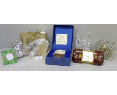 A collection of vintage 20th Century travel clocks including glass and a Pukeberg paperweight; a Europe 7 jewels clock in fau