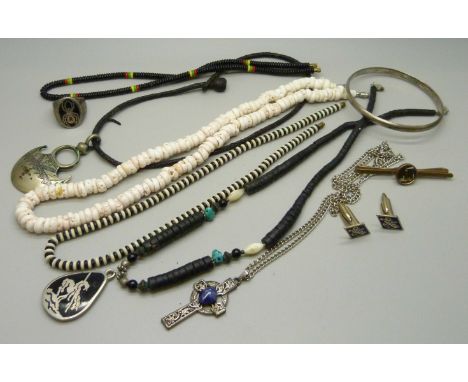 A silver bangle, a ring with spider detail, a Navajo style necklace, a pair of Riley cufflinks, etc. 