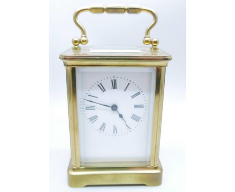 A brass and glass sided carriage clock 
