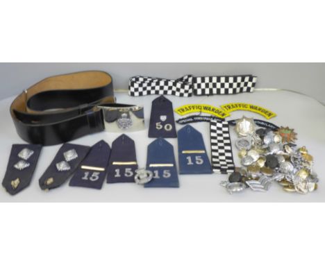 A collection of Police memorabilia including leather belt, epaulettes, badges and buttons, the majority Leicestershire and Ru