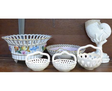 A Royal Worcester porcelain nautilus vase, 17cm, three Royal Creamware baskets and two Dresden pierced baskets 