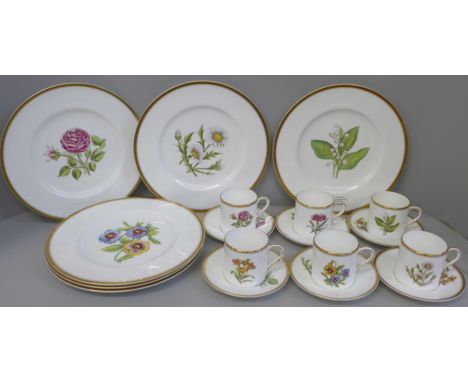 A set of six Royal Worcester hand painted coffee cans, saucers and plates, decorated with flowers, one coffee can restored 