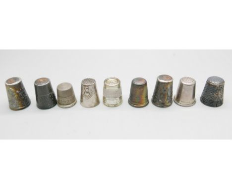 Eight silver thimbles and one other thimble 