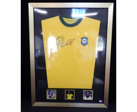 A FRAMED SIGNED PELE SHIRTframe 66.5 x 86.5cm, with certificate of authenticity (perspex not glass)