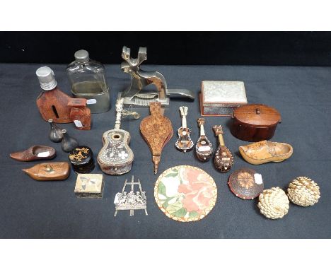 A REINDEER NUT CRACKERwith a collection of other items including spirit flasks, miniature musical instruments, a sewing set, 