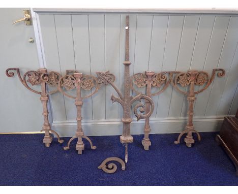 A GOTHIC STYLE IRON FINIAL91cm high plus 18cm fixing spike (damaged, incomplete), and a set of four railing stanchions 81cm h